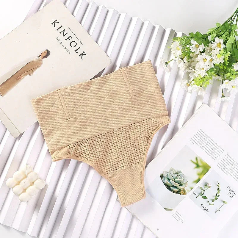 Beige skin-toned high-waist seamless compression thong with smooth, no-seam design