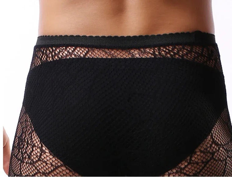 Close-up of black lace pantyhose waistband and sheer patterned leg panels