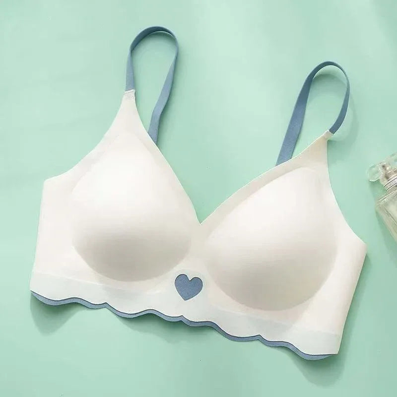 Blue seamless wire-free 3/4 cup bra, molded cups with scalloped hem and heart emblem