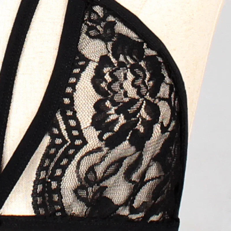 Close-up of black lace bra cup with floral lace overlay