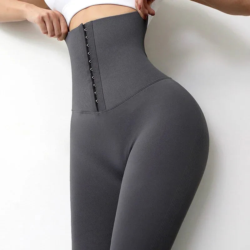 Gray high-waist corset tights with lace-up waist panel and smooth, supportive stretch