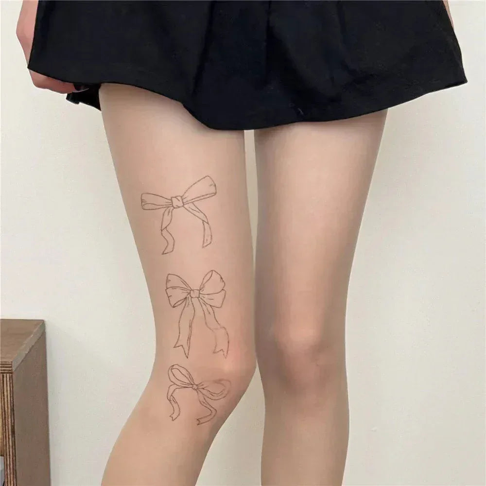 Front view sheer stockings with three ribbon bow prints, light skin tone