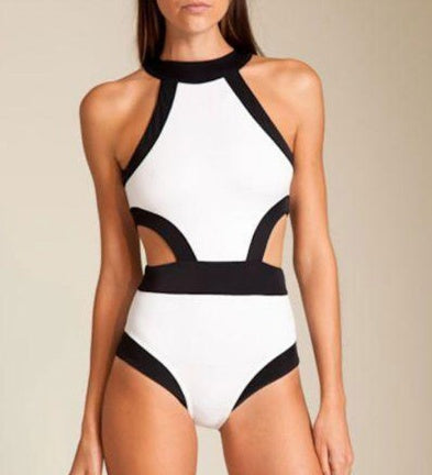 Black-and-white halter one-piece swimsuit with front cutout and curved leg panels