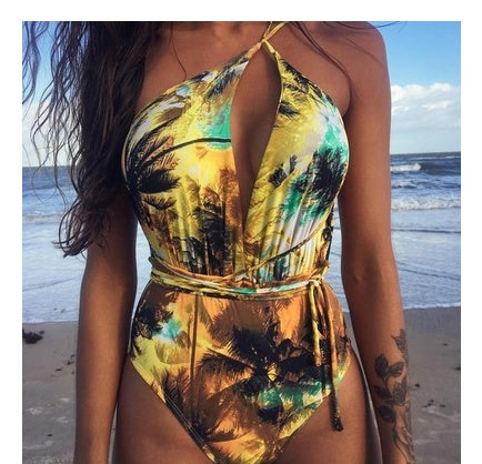 Backless monokini swimsuit with golden-yellow and multicolor jungle palm print