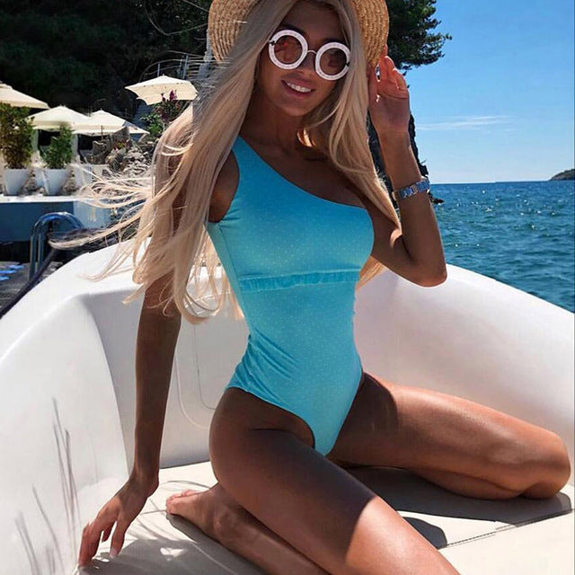 Light blue one-piece monokini swimsuit with side cutouts