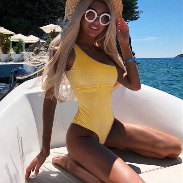 Yellow one-piece monokini swimsuit with side cutouts