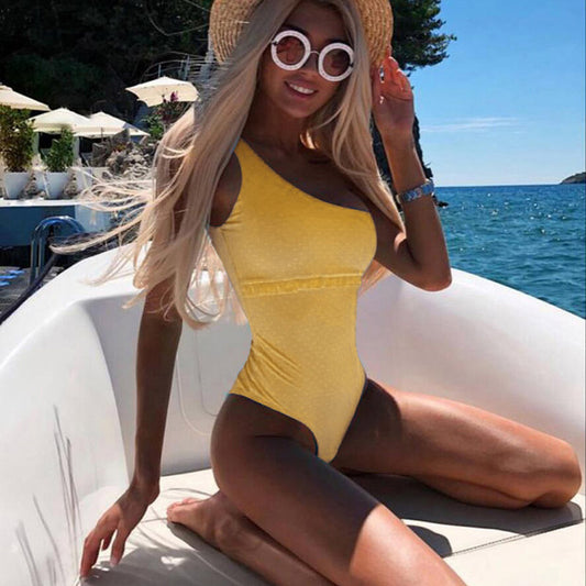 Yellow one-piece monokini swimsuit with side cutouts