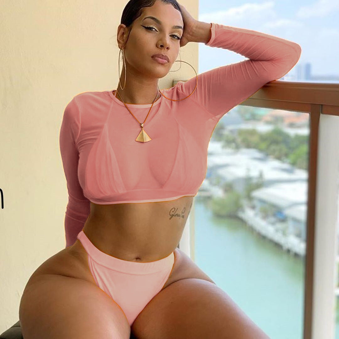 Pink long-sleeve bikini set with cropped top and high-cut thong-style bottoms