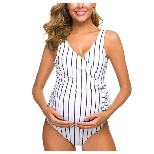 White maternity one-piece swimsuit with vertical black stripes, V-neck and waist tie