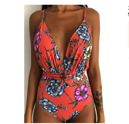 Backless one-piece monokini with red floral print, deep V neckline and tied waist belt