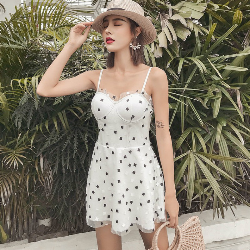 White square-print one-piece swimsuit with spaghetti straps and fitted bust