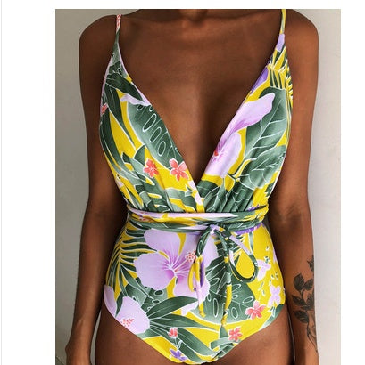 Backless monokini with yellow and purple tropical floral leaf print, deep V and tie belt