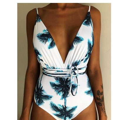 Backless monokini with white base and teal feather print, deep V and tie waist