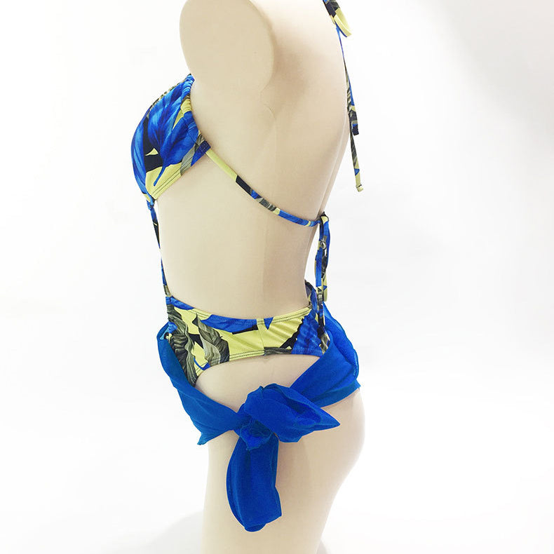 Backless printed bikini one-piece swimsuit with blue sheer skirt tied at hip