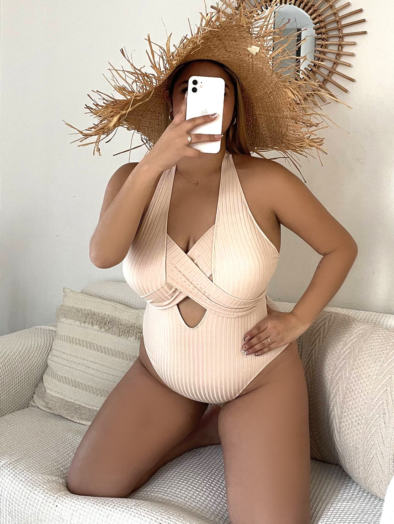 Beige ribbed halter one-piece swimsuit with center front cutout and low back