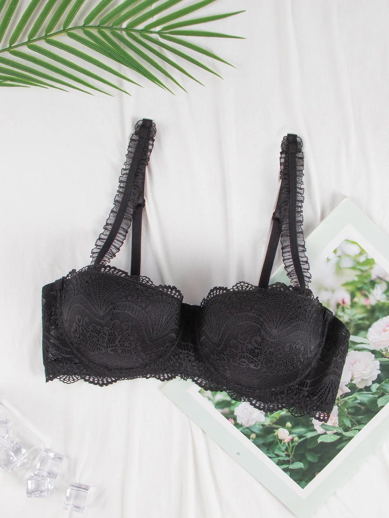 Black lace-trim underwire bra front view with scalloped lace edge on cups and straps