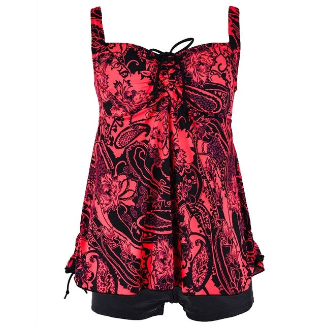 Plus size two-piece swim set in red paisley print with tie-front bodice and black skirted shorts