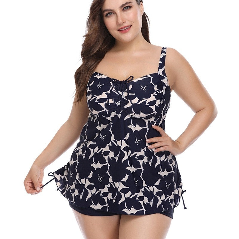 Plus size two-piece swim set with navy and white cat print, tie-front tank and swim shorts