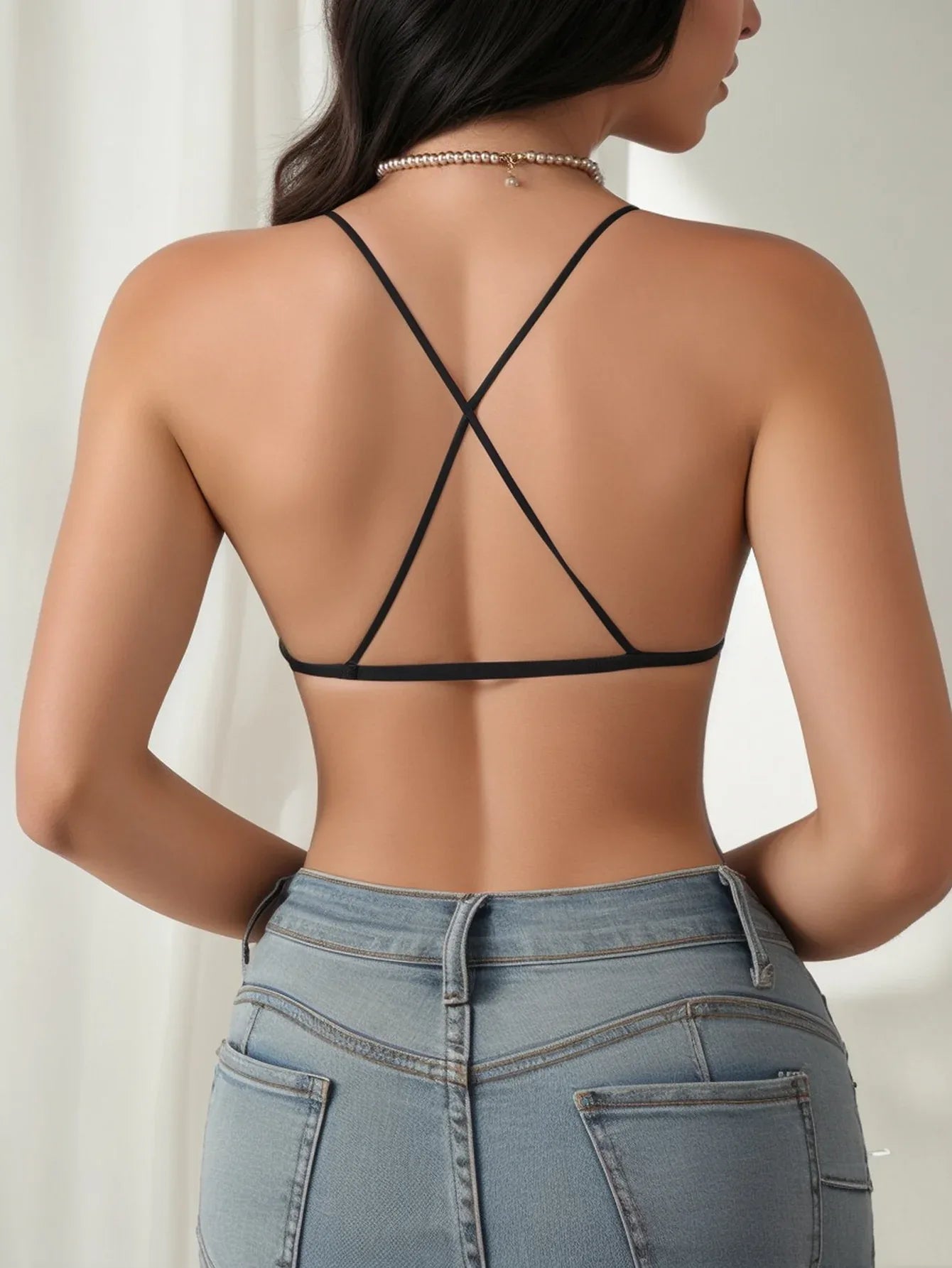 Black lace lingerie set bra from back: crisscross strap design, sheer lace overlay