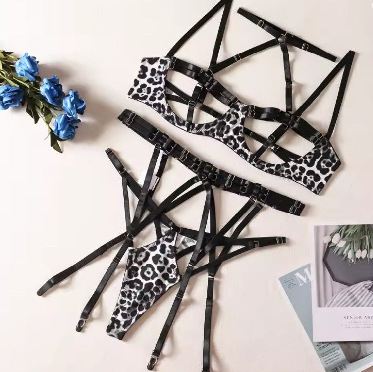 Leopard print hollow-out lingerie set with black harness straps and metal buckles